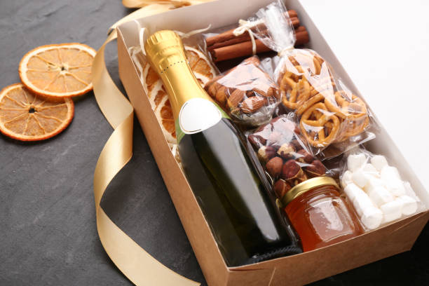 istock Box with stylish craft gift set on black slate table, closeup 1391089645