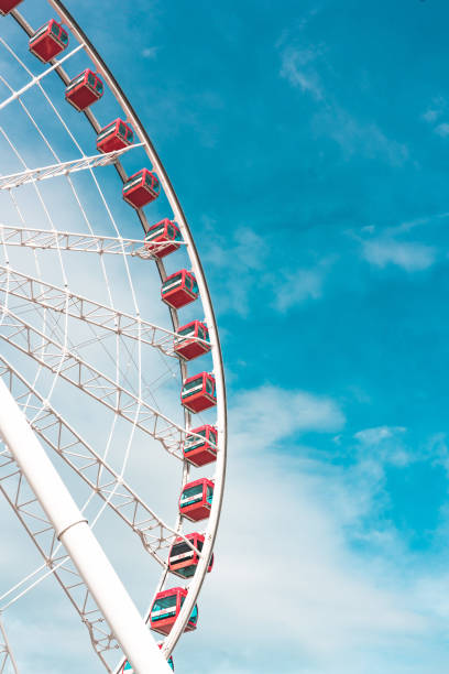 istock Ferris wheel in the blue sky and white clouds background 1391090485