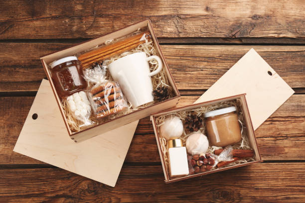 istock Boxes with stylish craft gift sets on wooden table, flat lay 1391091142
