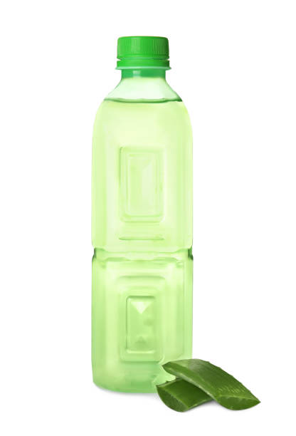 Bottle with fresh aloe drink and leaf on white background Bottle with fresh aloe drink and leaf on white background aloe juice stock pictures, royalty-free photos & images