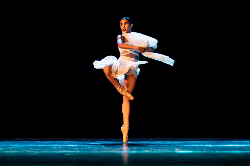 Teenage girl dancing Neoclassical ballet on stage