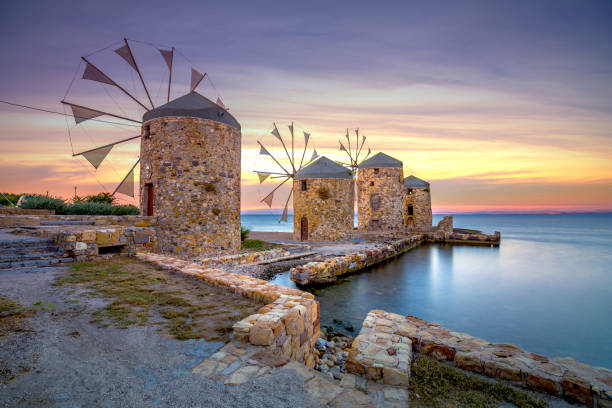 istock Old windmills by the beach, Chios island, Greece. 1391094657