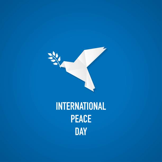 International peace day background White origami dove silhouette and olive branch. International peace day background with paper bird isolated on blue background ukraine war stock illustrations