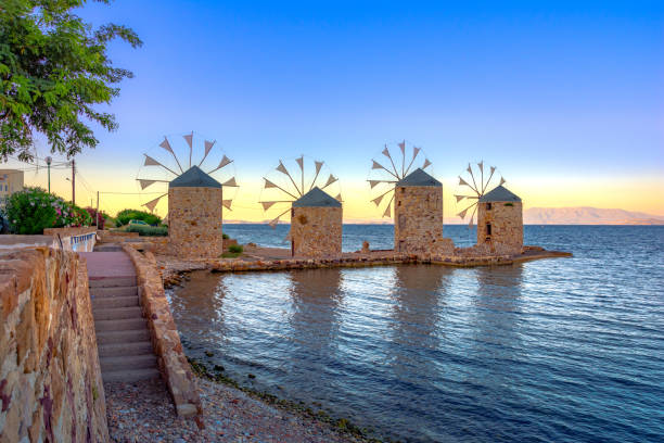 Old windmills by the beach, Chios island, Greece.