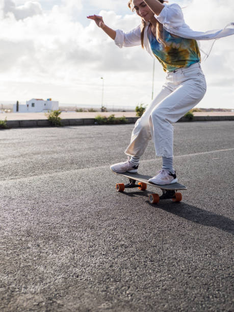 istock Skateboarder young woman on the move 1391095622