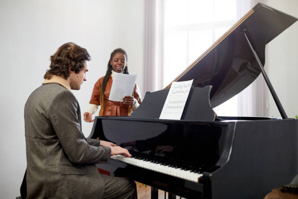 istock People visiting the musical lesson at school 1391097929