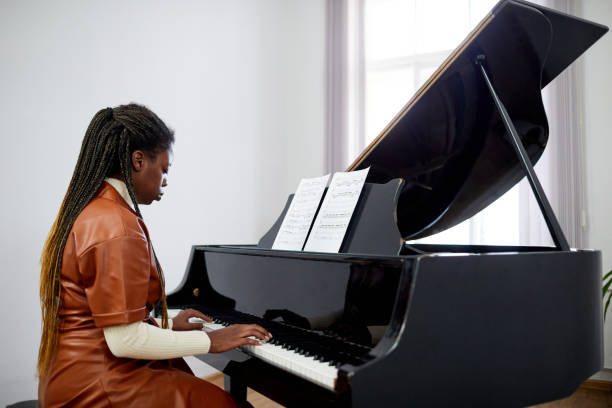 istock Young pianist playing the grand piano 1391097960