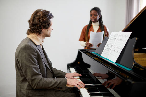 istock Teacher teaching a Music lesson to a student 1391098664
