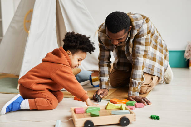 istock Young Father and Son Playing with Toys 1391099670