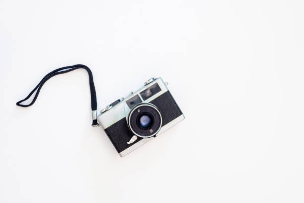 istock Old film photo camera on a white background. 1391100809