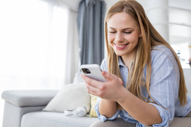 istock Young woman with smart phone 1391101353
