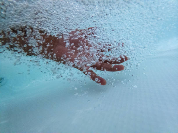 istock Hand inside the hot tub 1391102122