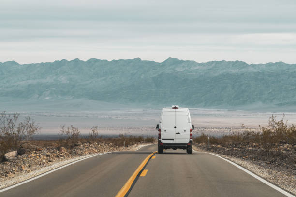 Driving through Death Valley National Park in a converted transit van