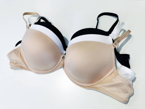 istock Bras with a molded cup in beige, white, black colors on a white background. Basic collection of lingerie. 1391103153