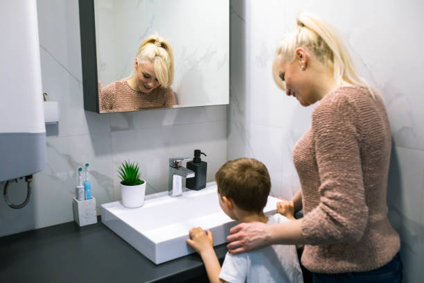 istock Mother and son in the bathroom 1391103546