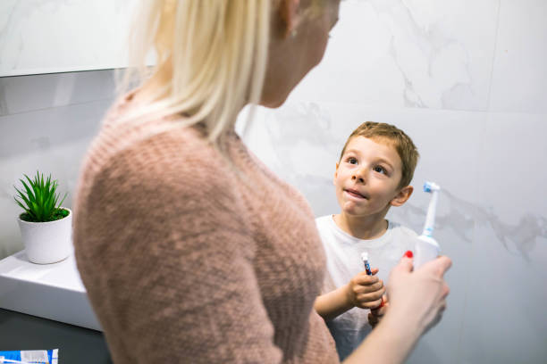 istock Mom teaching her son about oral hygiene 1391103565