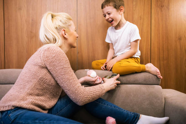istock A cute boy having fun with his mom at Easter 1391103589