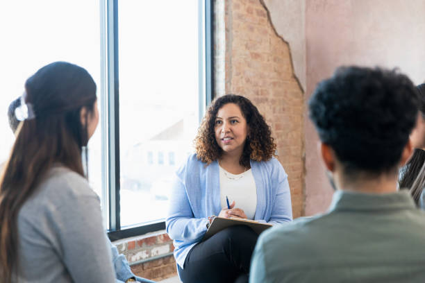 istock Female therapist listens to unrecognizable female client 1391105599