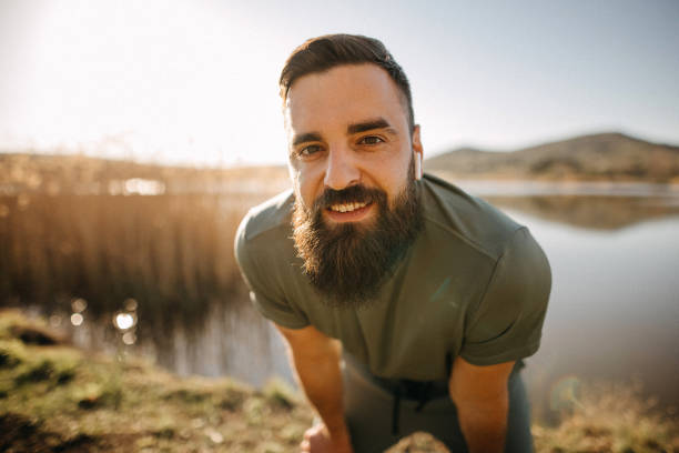 istock Man with large beard standing outdoors 1391105970