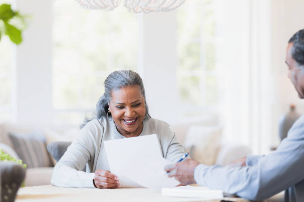 istock Senior widow receives advice from male accountant 1391106014