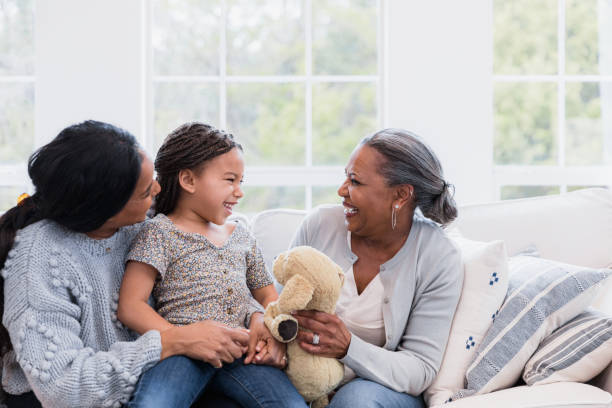 istock Three generations smile and laugh together 1391107256