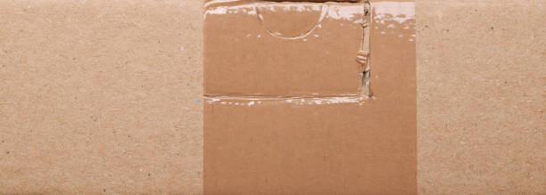 istock Empty mail packet.Texture of old organic cardboard, beige paper, background for design, copy space. 1391107306