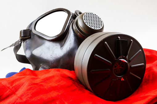 Gas Mask on a red  fabric.