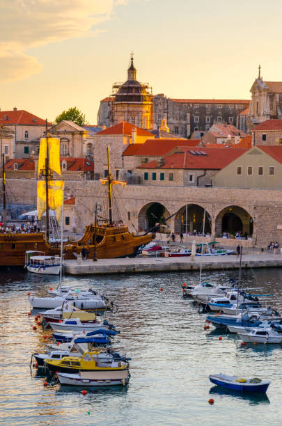 Sunset panoramic view on walls and port of famous old city Dubrovnik, Croatia Sunset panoramic view on walls and port of famous old city Dubrovnik, Croatia dubrovnik stock pictures, royalty-free photos & images