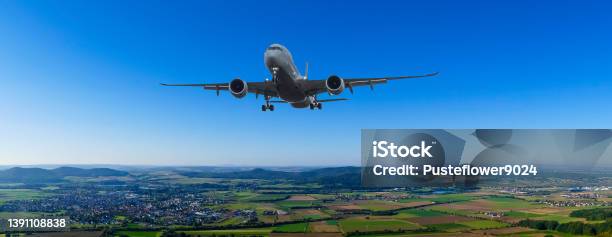 Plane Flys Over Bavarian Landscape Stock Photo - Download Image Now - Above, Aerial View, Airplane