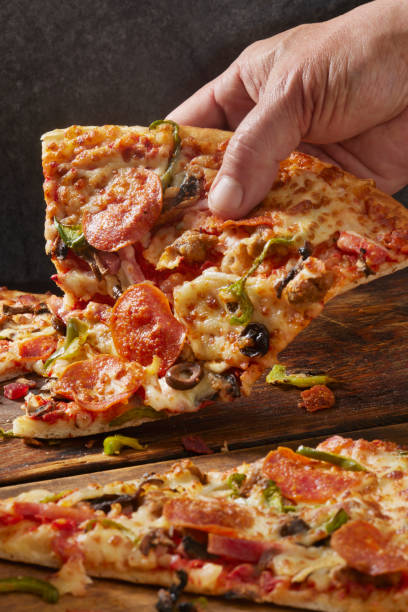 istock Deluxe New York Style Pizza 1391110950
