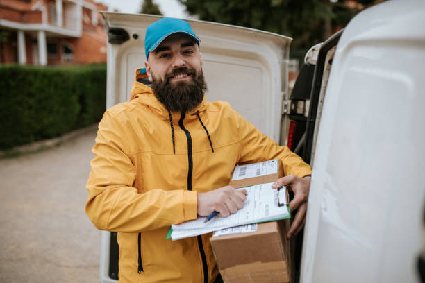 istock Portrait of a smiling postman 1391113979