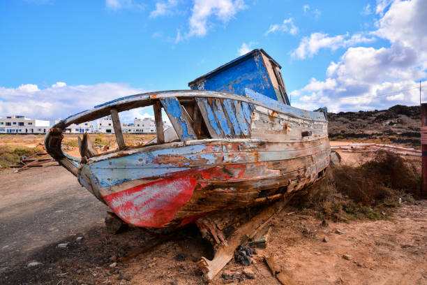 istock Wooden boat on beach 1391118197