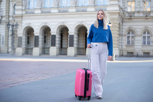 istock Tourist with her luggage 1391122658