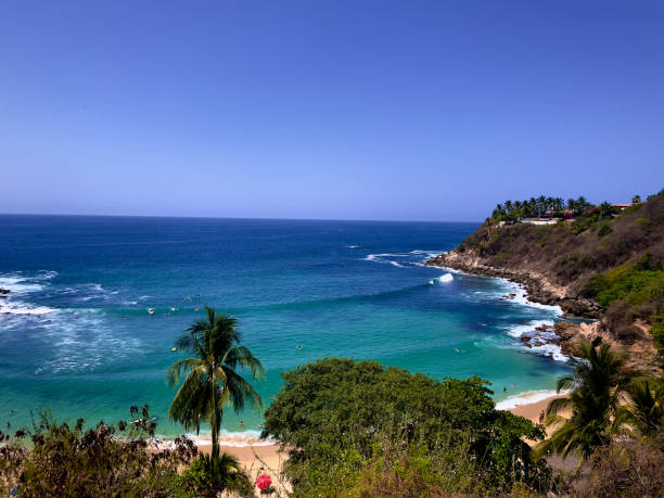 Carizallio Beach Playa Carizallio is known for being the most beautiful beach in Puerto Escondido in the State of Oaxaca in Mexico. pacific coast stock pictures, royalty-free photos & images