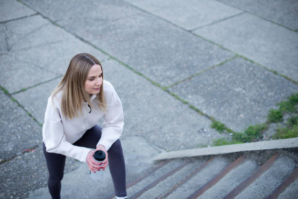 istock Sportswoman taking a breath after jogging 1391127887