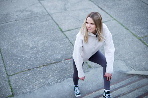 istock Sportswoman taking a breath after jogging 1391127893