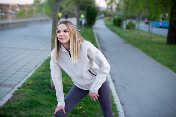 istock Sportswoman taking a breath after jogging 1391127907