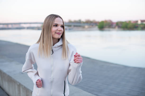 istock Young woman runner running 1391127912
