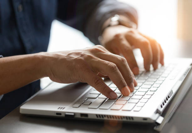 istock Man hand working on the laptop in office 1391127921