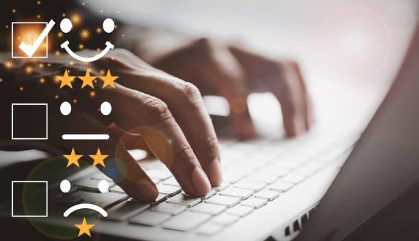 istock Satisfaction customer service survey concept, business man hand analyzing the questionnaire and combining the satisfaction score, giving satisfaction rating with smiley icon and five yellow stars 1391127922