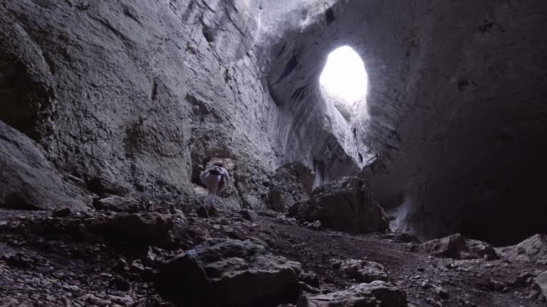 Tourist visiting the Eyes of God cave.