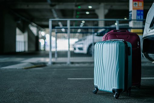 Suitcases in the airport parking lot