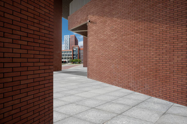 Slate road passes through red brick buildings, and the distant scenery forms a sense of perspective