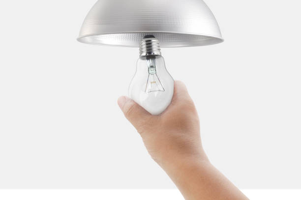 istock closeup hand changing an electric light bulb 1391137795