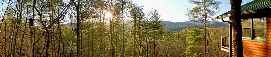 A Panorama of a Cabin Hidden in the Blue Ridge Mountains  Overlooking  Other Mountains From Within Dense Trees.