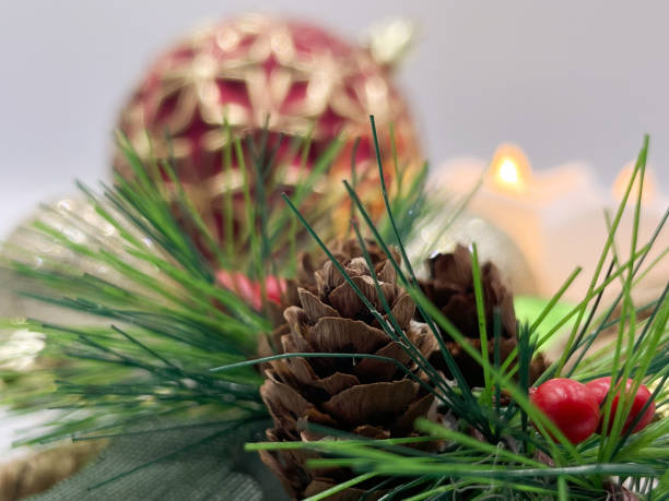 istock Pine seeds, green foliage and other typical Christmas decoration elements 1391143399