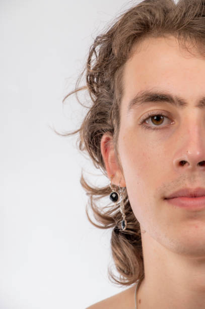 istock half face portrait of young man. 1391153232