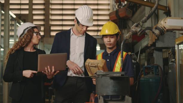 istock business engineering in hardhats discuss information on laptop computer 1391153964