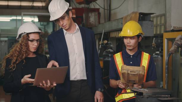 istock business engineering in hardhats discuss information on laptop computer 1391153973