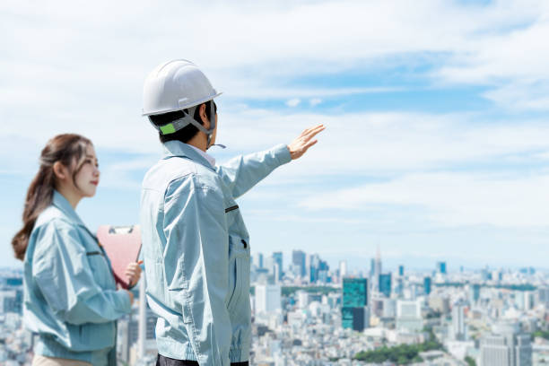 istock Asian workers having a meeting at the construction site 1391158693